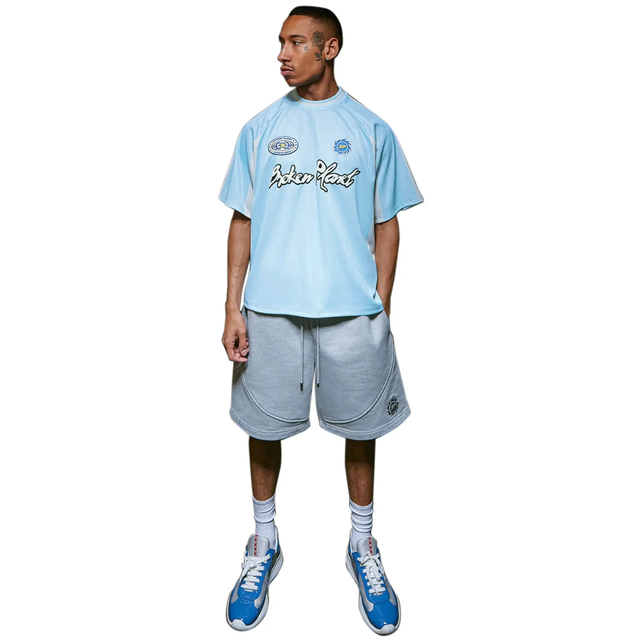 Model front view of Broken Planet Light Blue Football Jersey